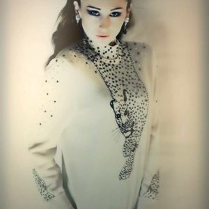 Couture original cougar pull over sweater